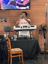 a man standing in front of a dj booth