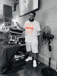 a man standing in front of a dj booth